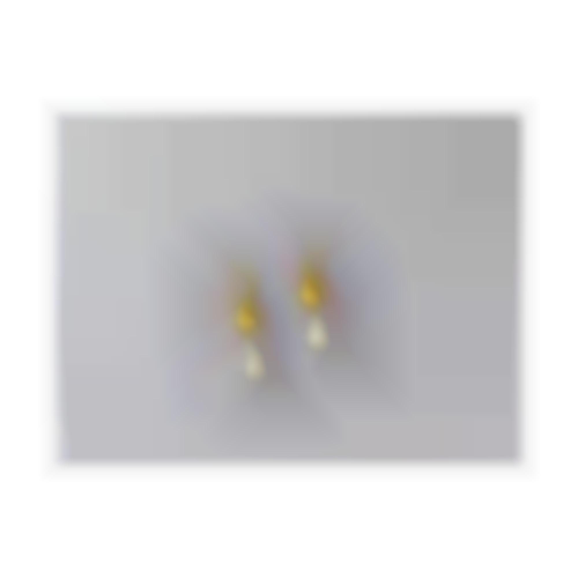 Earrings with baroque pearls set in yellow silver 