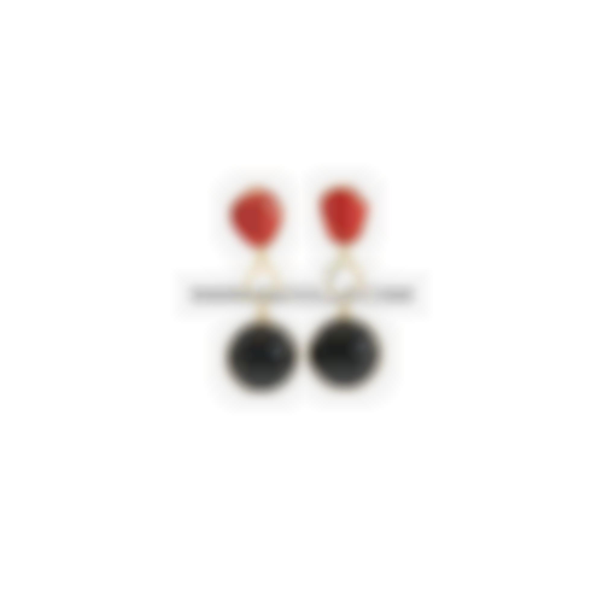Earrings set in silver with onyx and natural coral