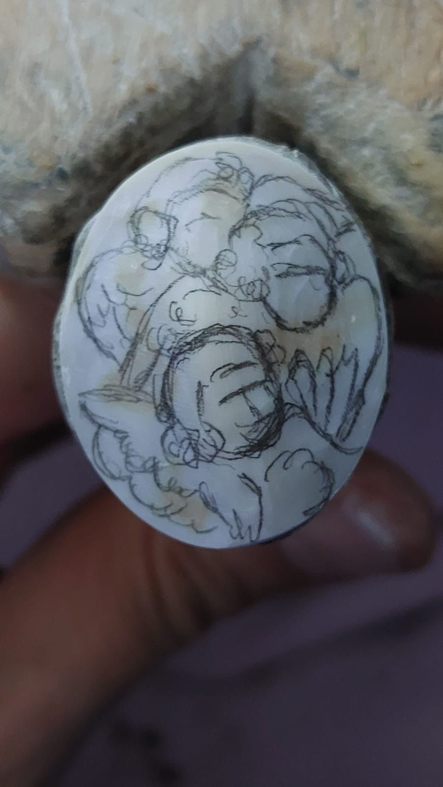 Angels carved on seashell