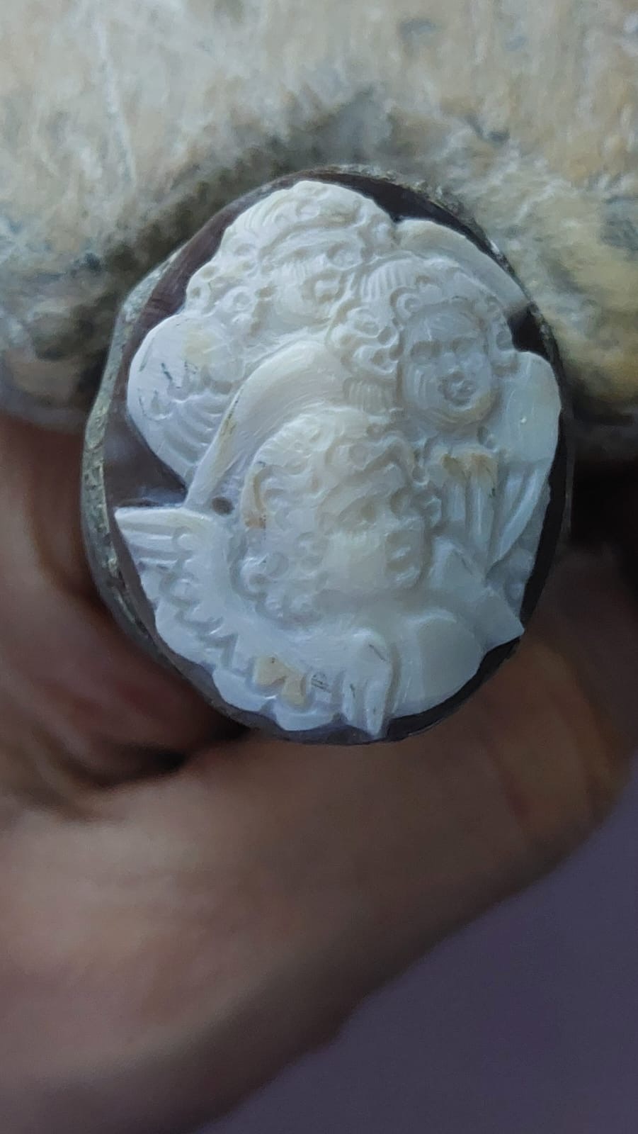 Angels carved on seashell