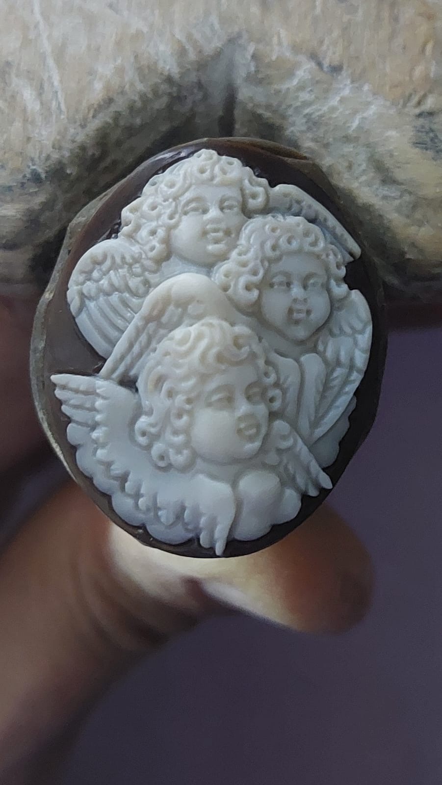Angels carved on seashell