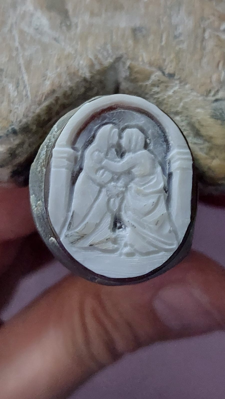 Visitation scene on natural seashell