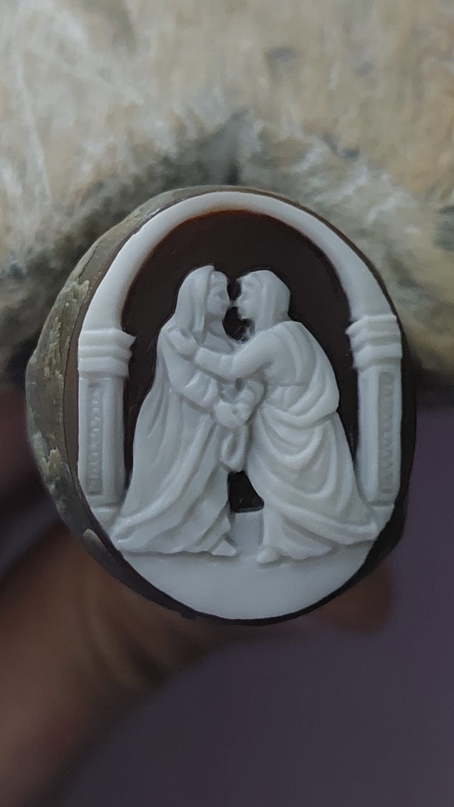 Visitation scene on natural seashell