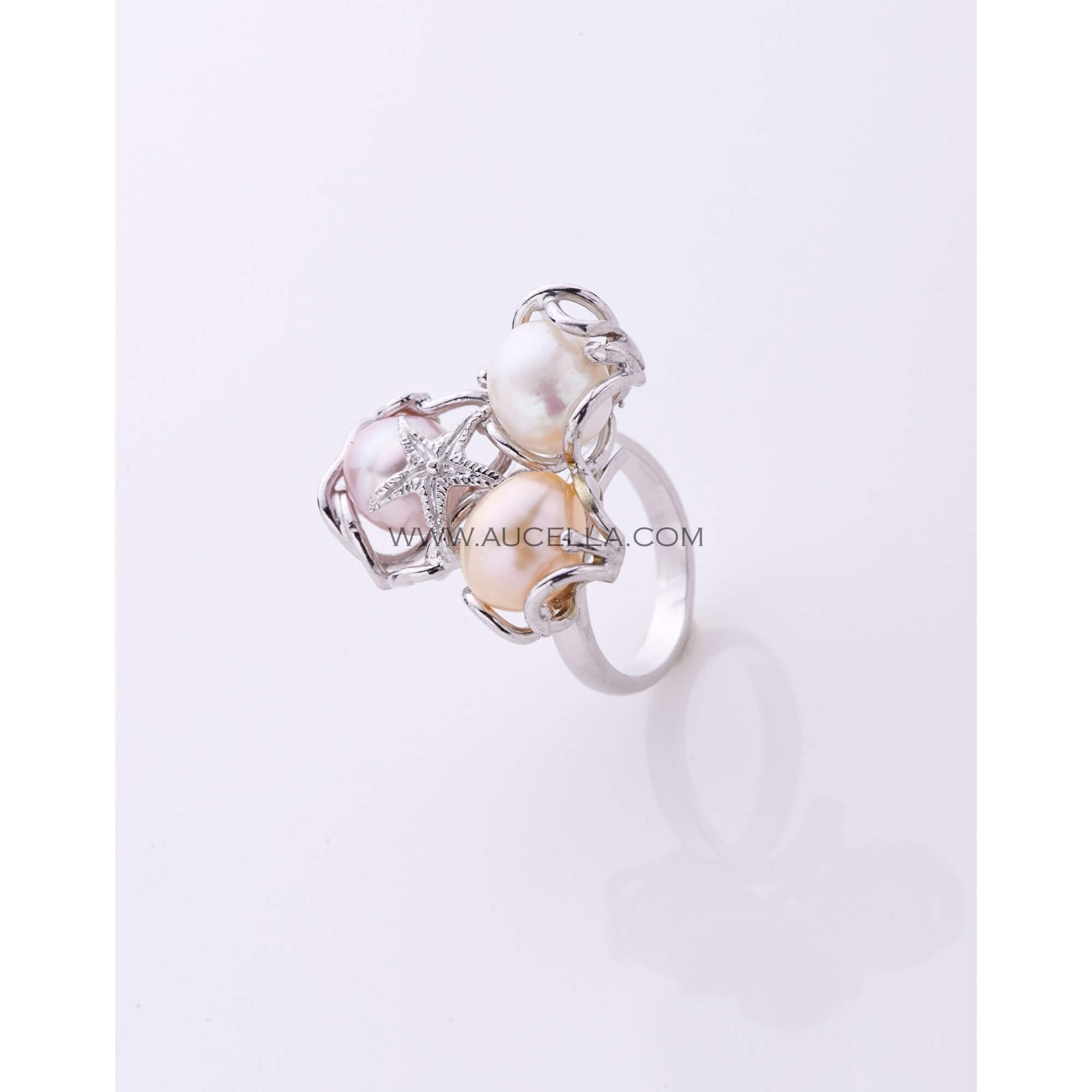 Ring set in silver with fresh water pearls 