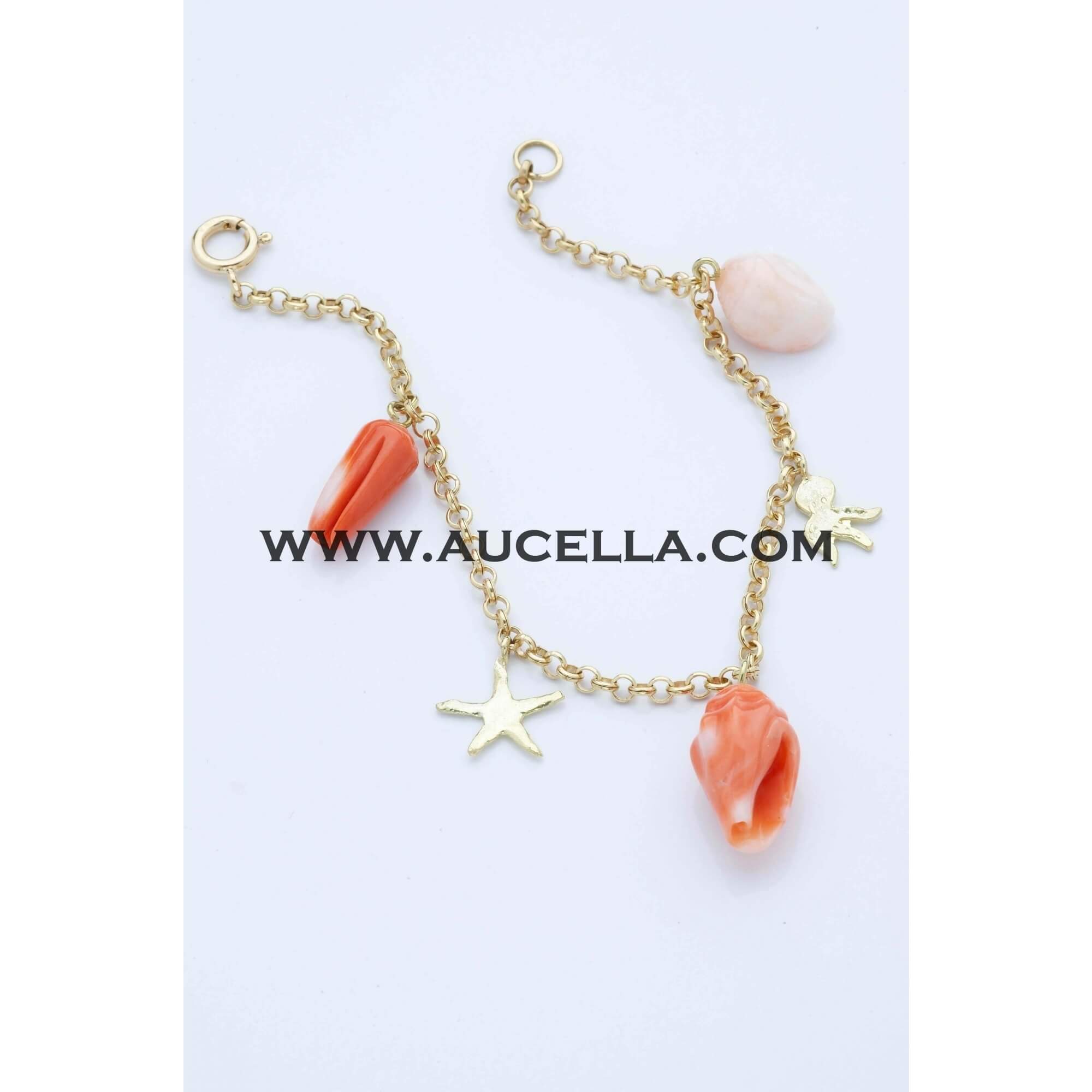Bracciale in oro giallo con animali in corallo 