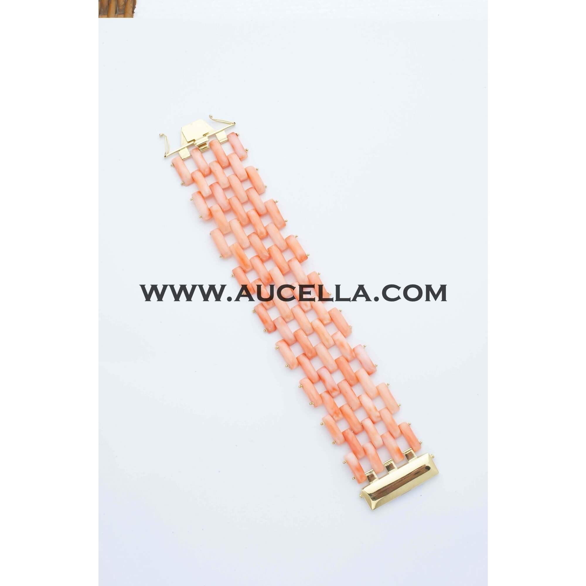 Gold bracelet with natural pink coral 