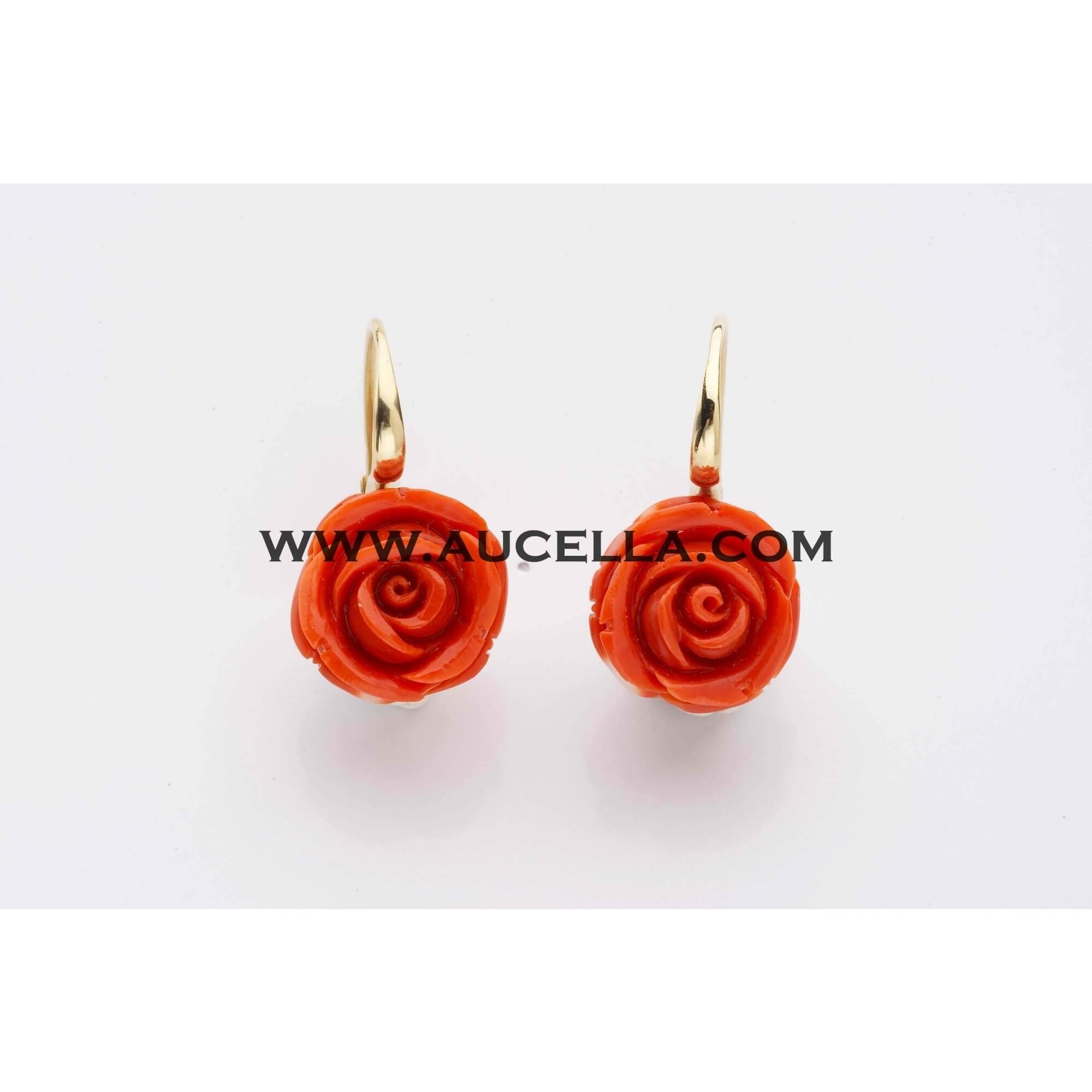 Natural red coral roses set in gold 