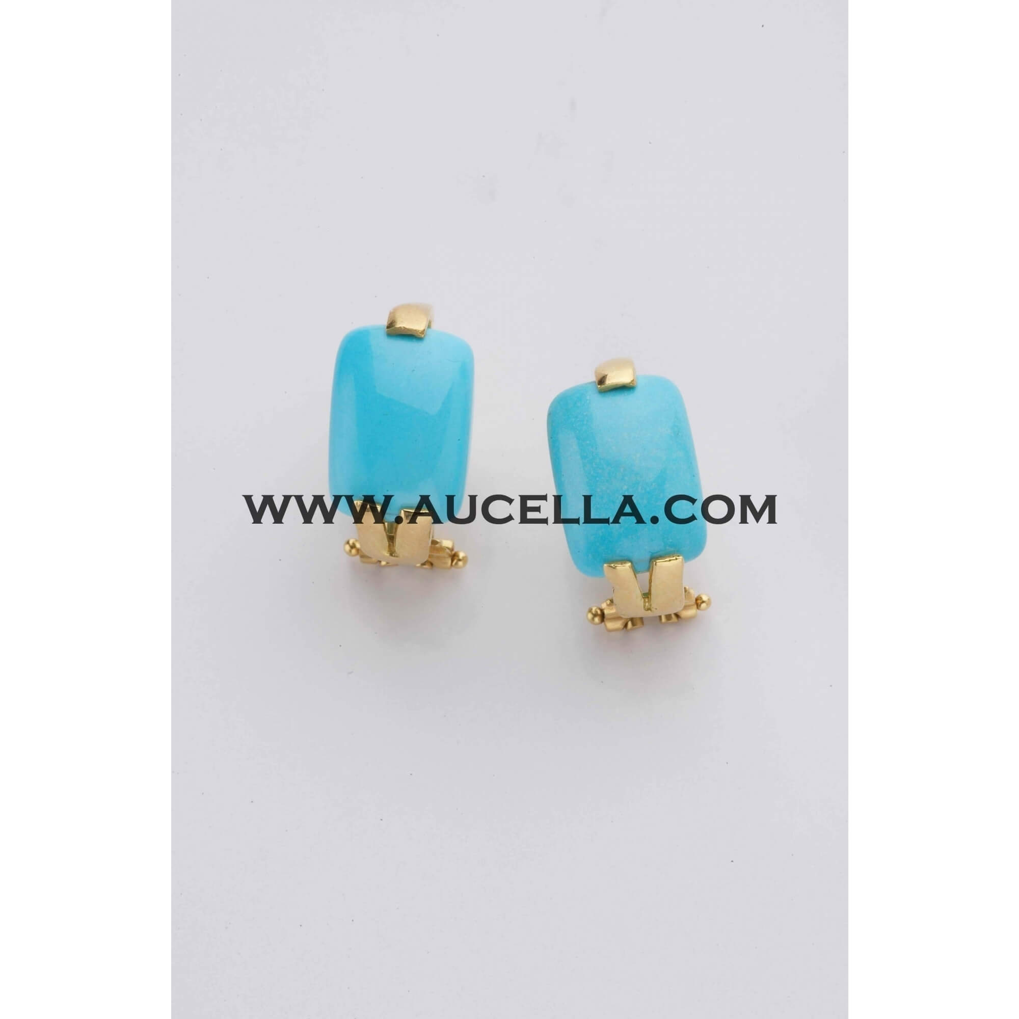 Earrings set in gold with natural turquoise cabochon