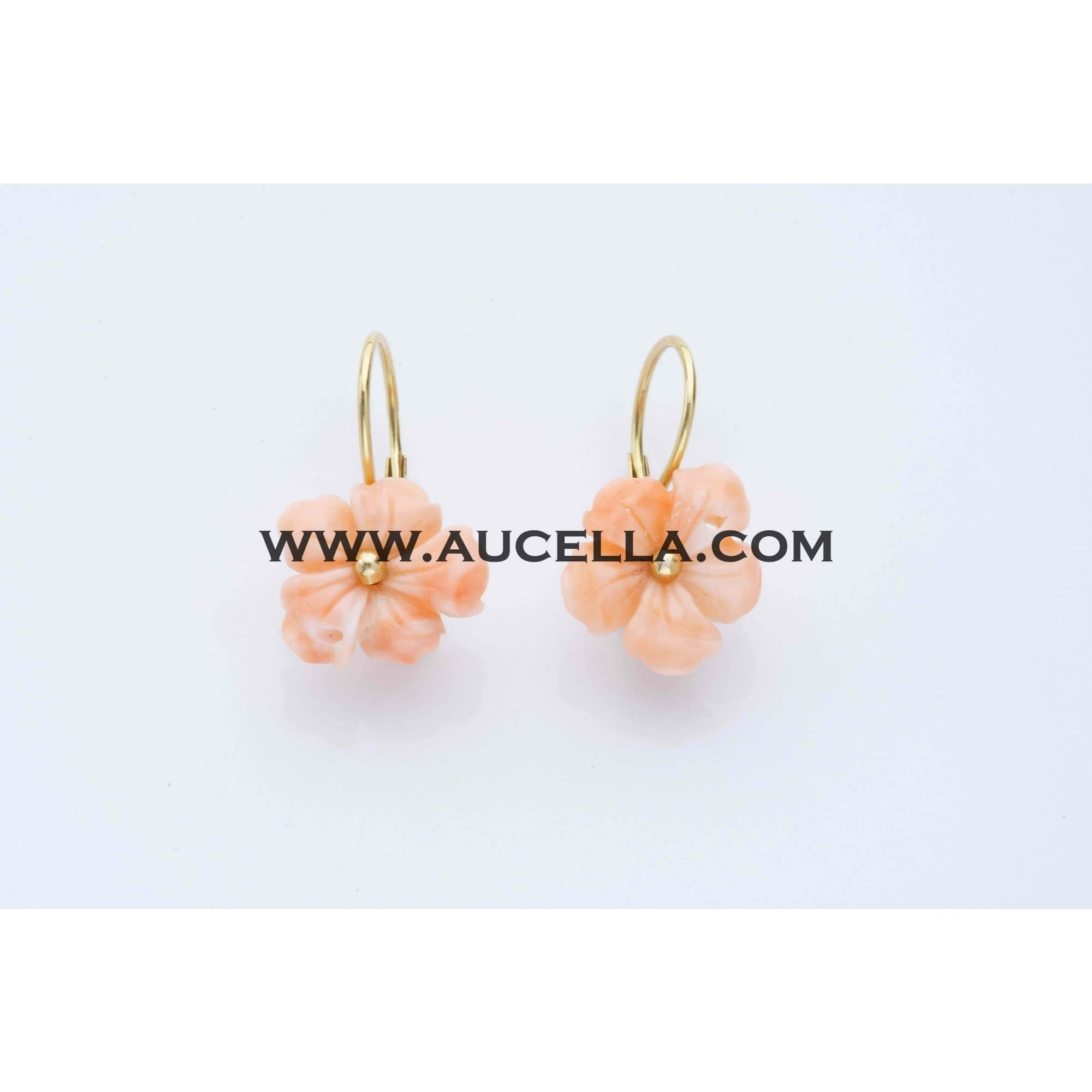Earrings set in gold with pink coral flowers 