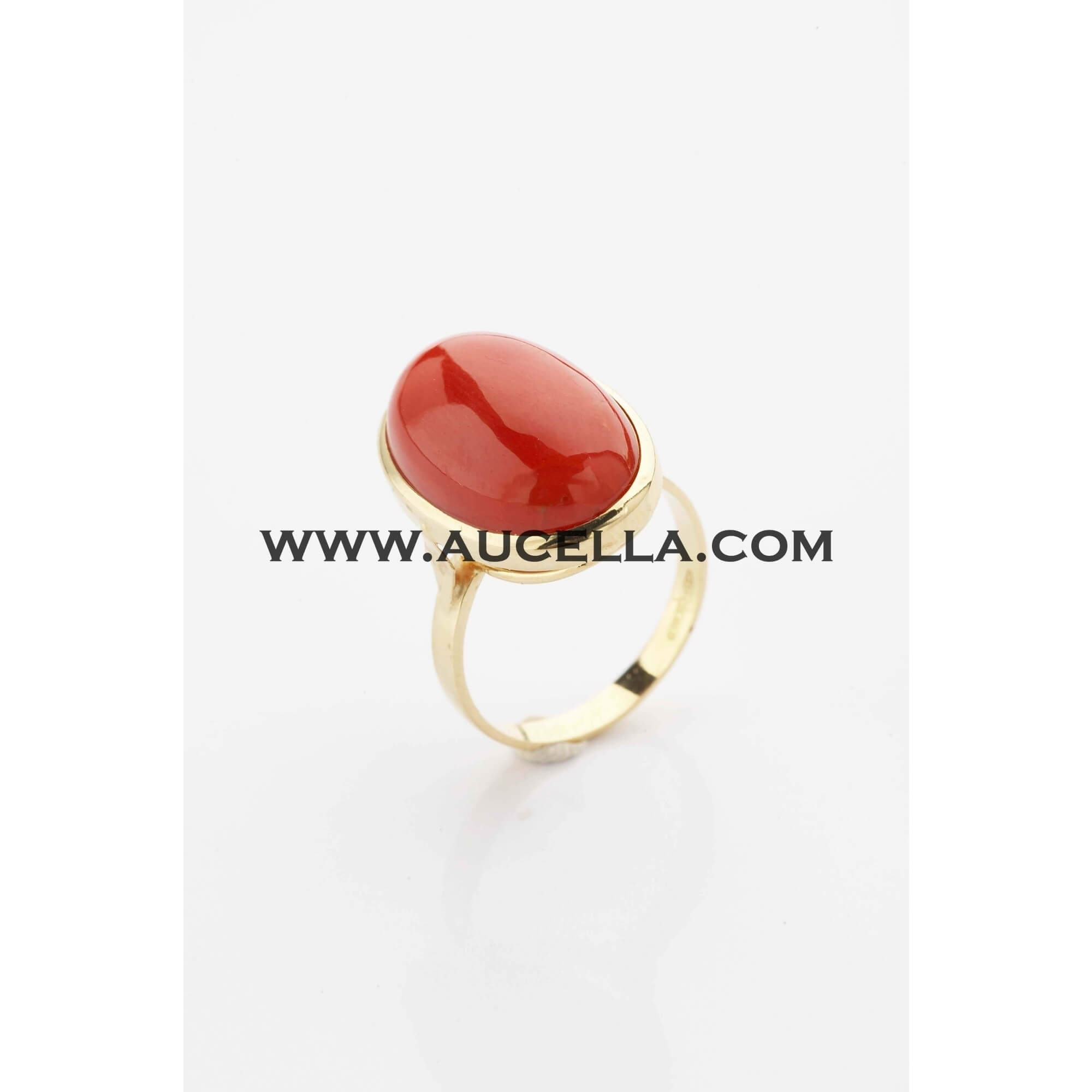 Ring set in gold with natural red coral 