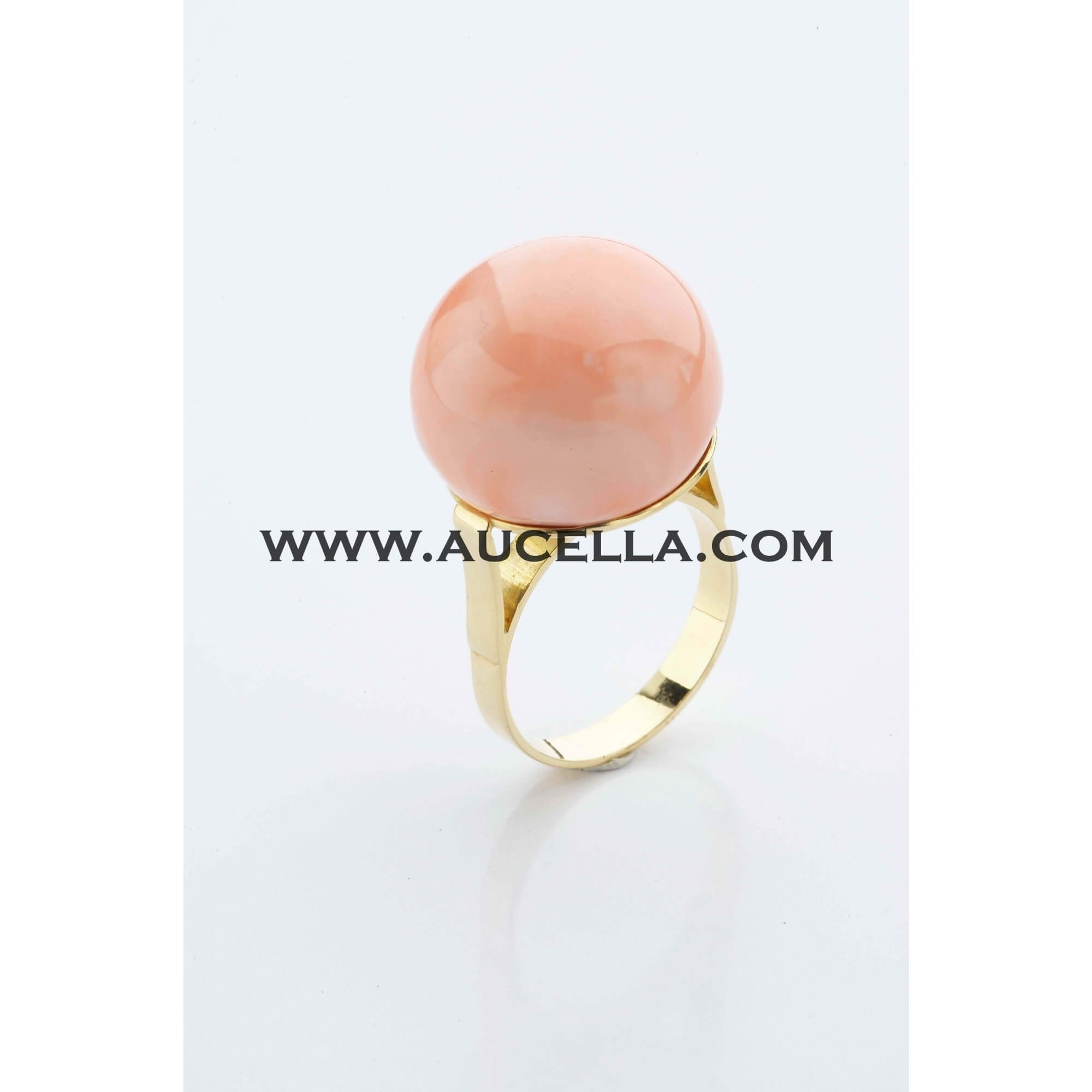 Pink coral bead set in yellow gold
