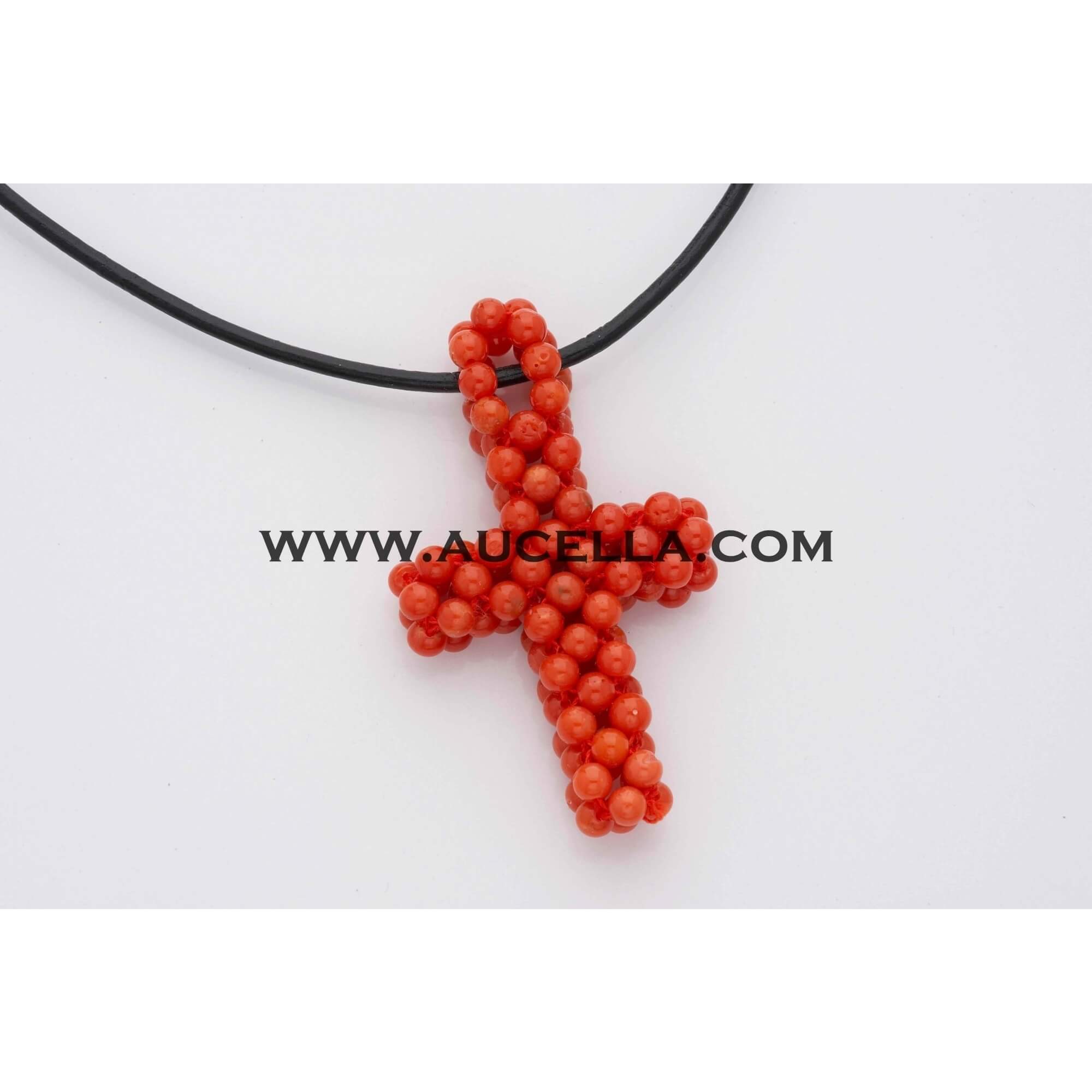 Pendant with coral cross shape 