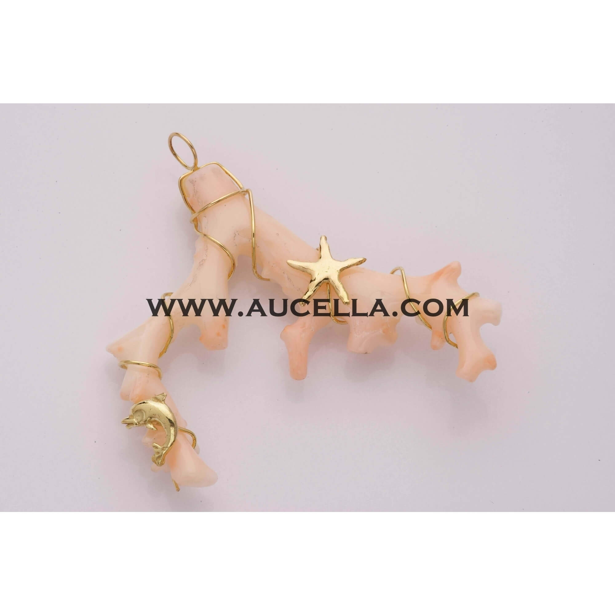 Pendant set in gold with pink coral branch