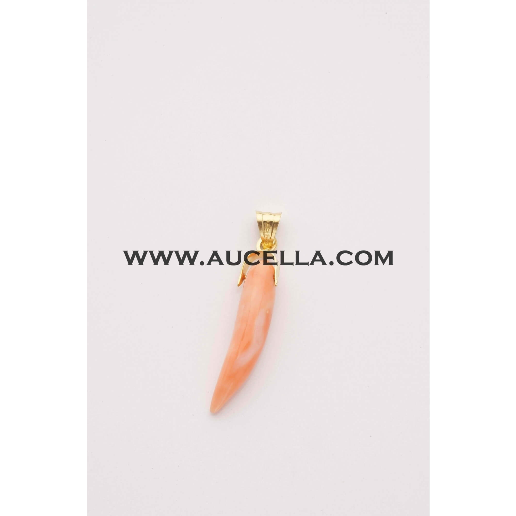 Pendant set in gold with natural coral carving