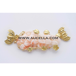 Clasp with pink coral set in gold 